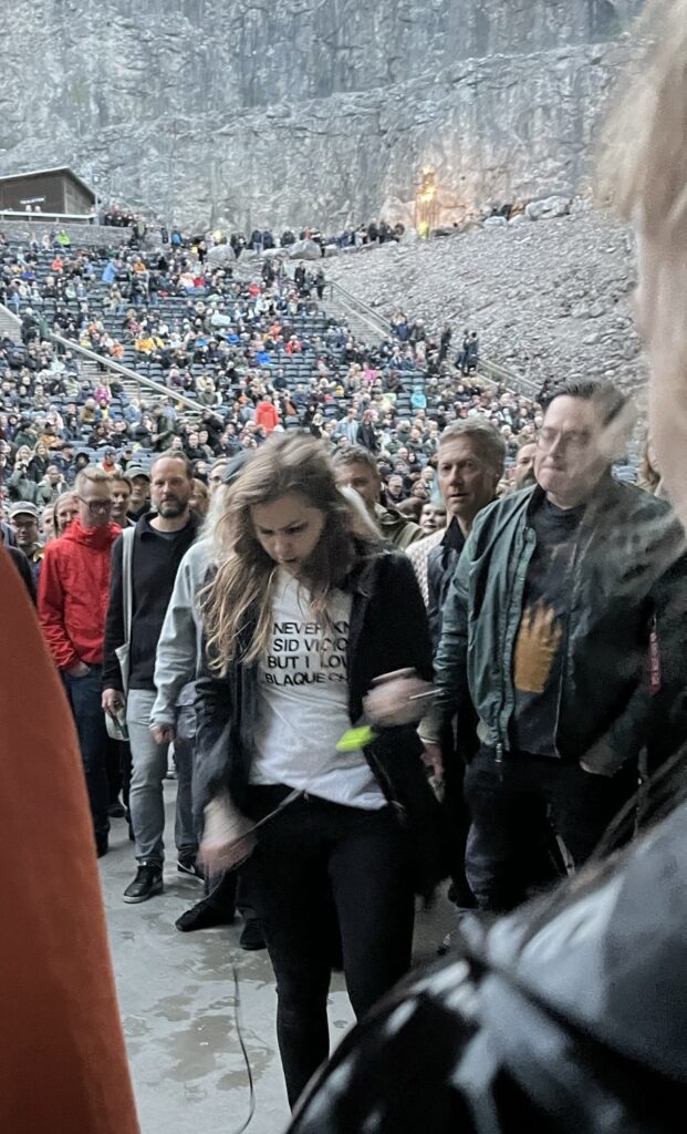 The singer from Youth Code performing in the middle of the crowd